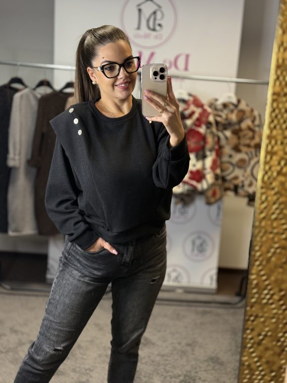 Vállánál fodros, arany színű gombokkal díszített,enyhén csillámos felső-fekete